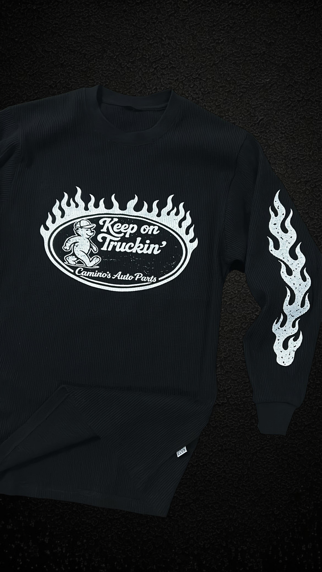 Camino’s Auto Parts black thermal long sleeve shirt with white bear graphic and flame sleeve prints