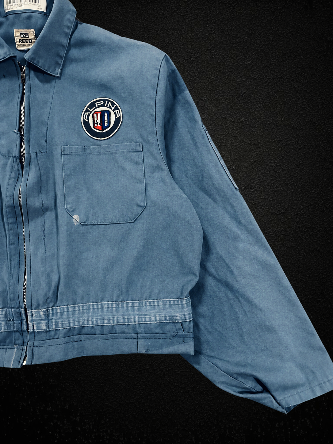 Camino’s Auto Parts blue reworked Mercedes Benz jacket with Alpina patch and front zip closure