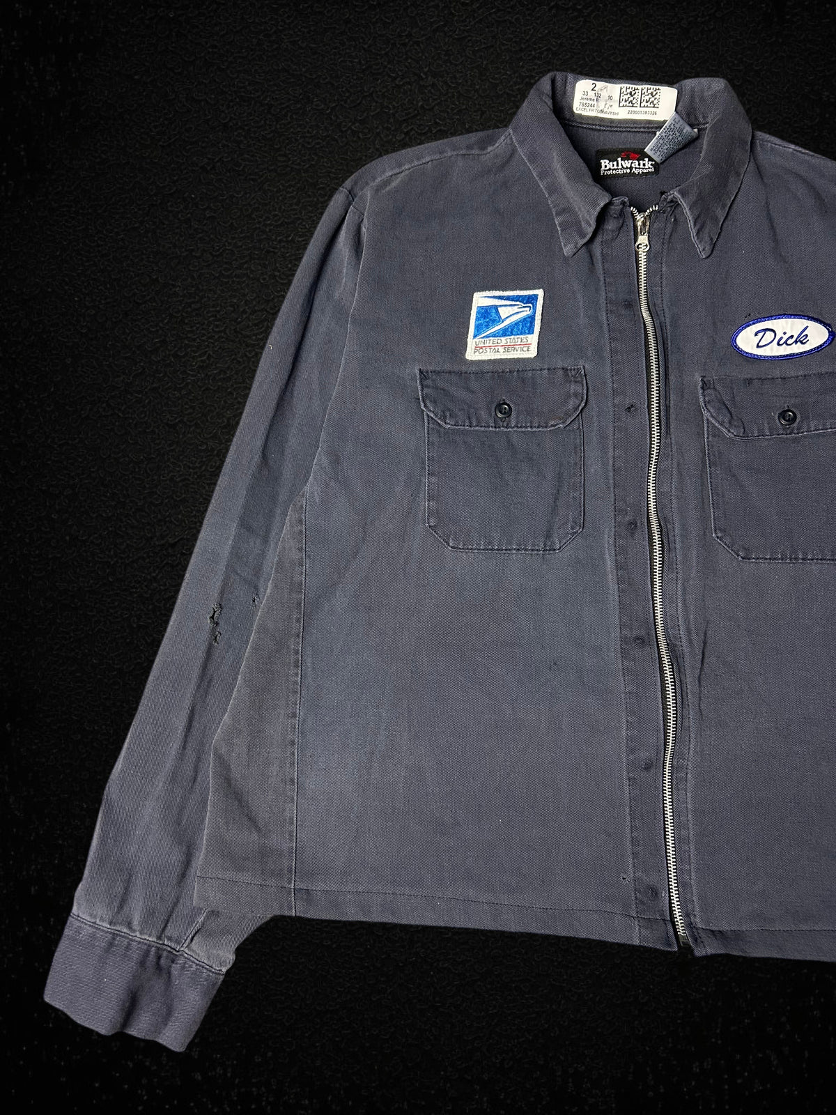 Camino’s Auto Parts vintage USPS reworked cropped work jacket in grey with front pockets and Dick name tag