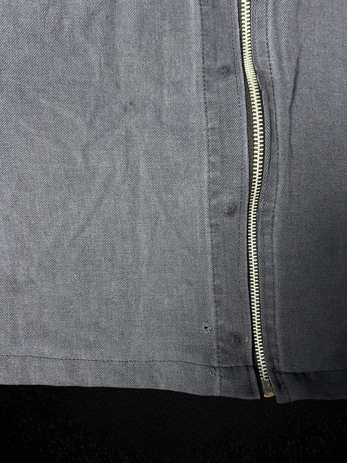 Camino’s Auto Parts vintage navy blue upcycled work jacket with silver zipper detail and small distressed hole