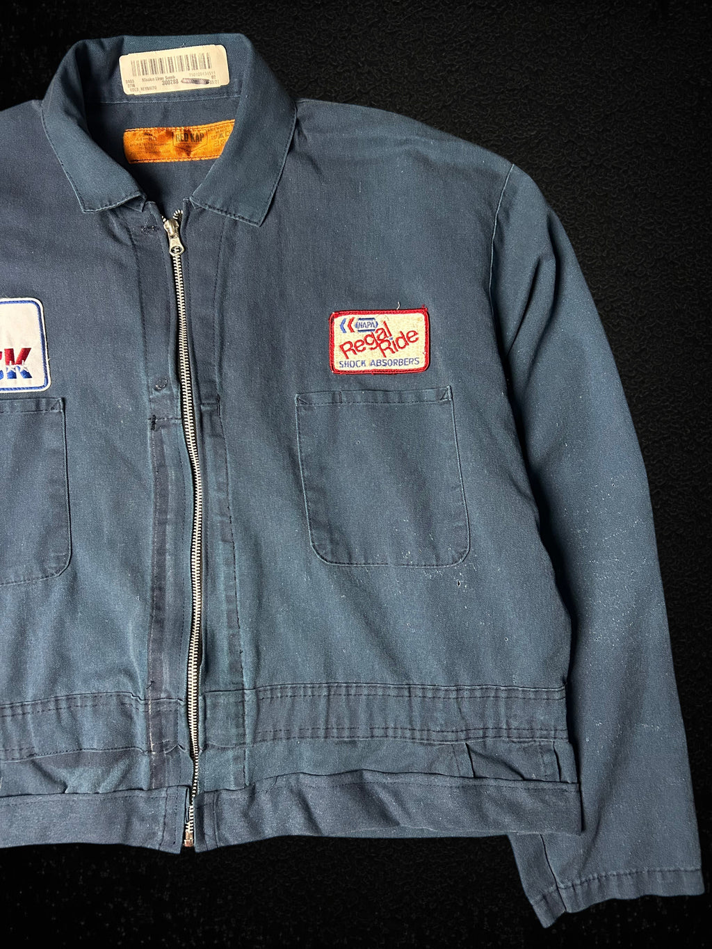 Camino’s Auto Parts upcycled navy blue cropped trucker jacket with vintage Mack Trucks and Napa patches